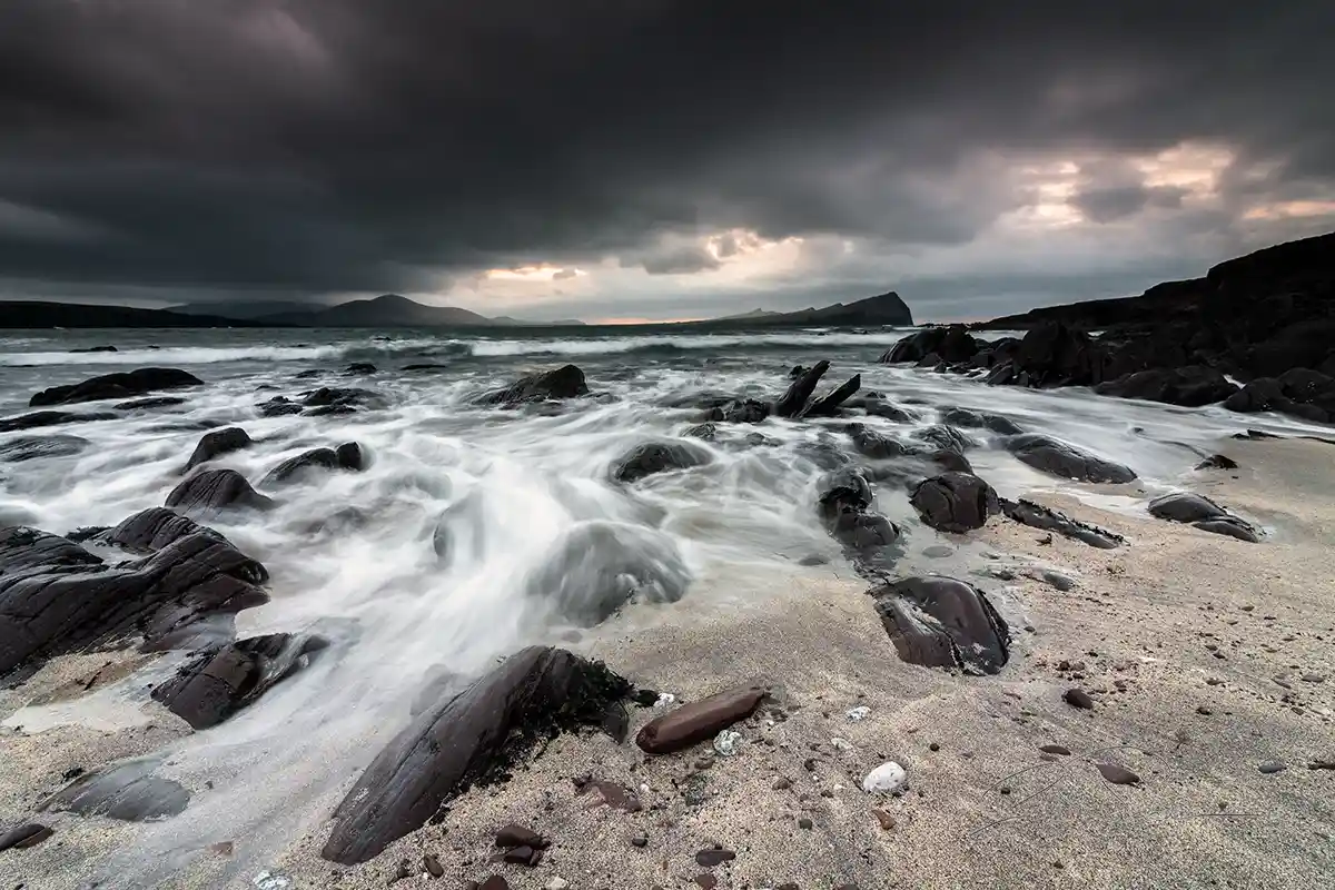 Racing-tide-at-Smerwick-Harbour-from-below-Ballydavid-Head-Dingle-Peninsula-Kerry-Ireland Racing tide at sunset on Smerwick Harbour, Dingle, Co. Kerry - Image 1